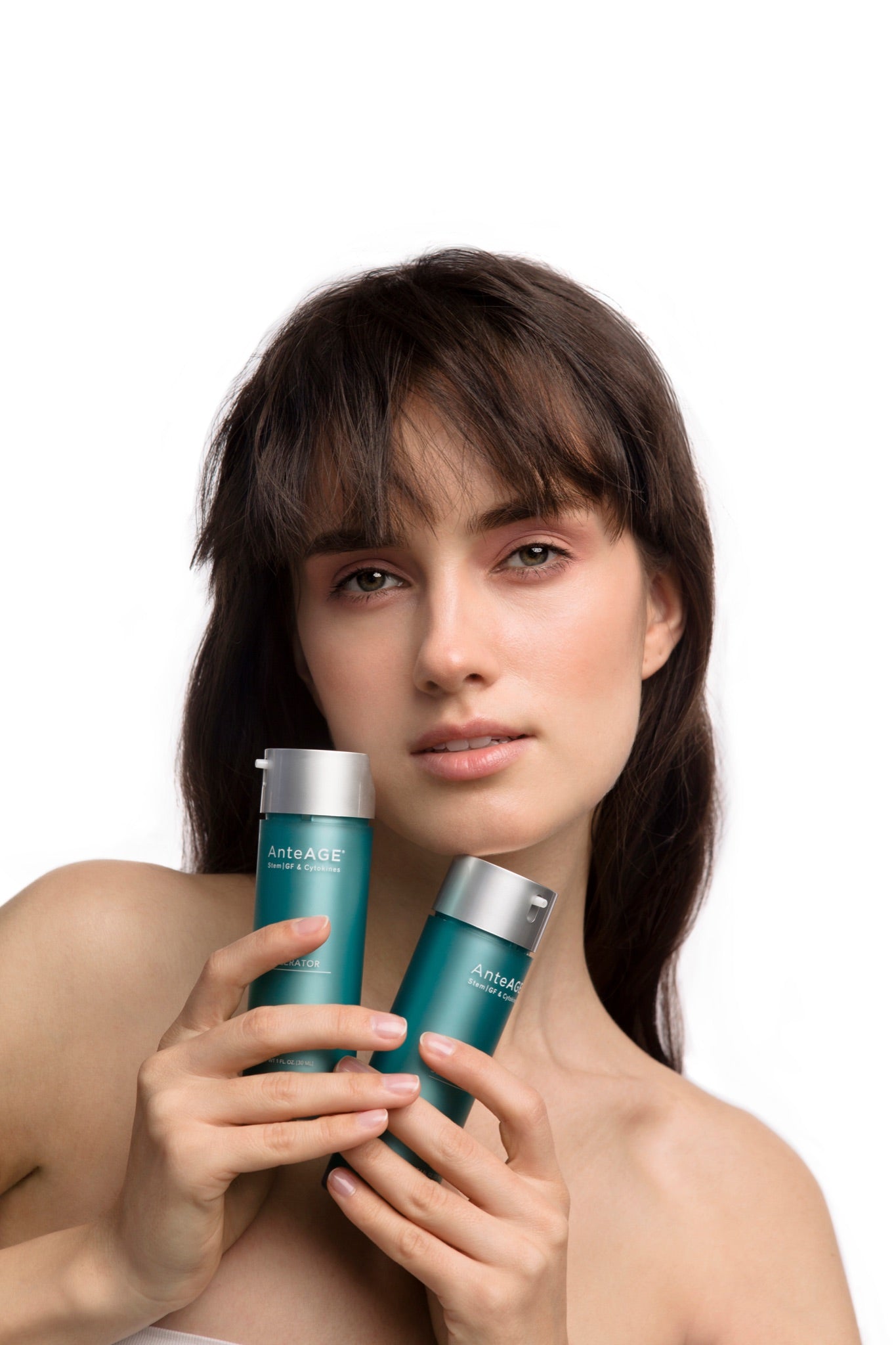 Model holding the AnteAGE Serum and Accelerator